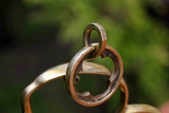 Старинный тяжёлый полированный двуносик из латуни