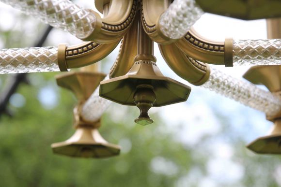 Очень интересная, необычная люстра из латуни.