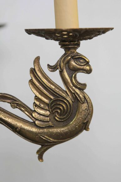 Бронзовая интересная люстра с Грифонами
