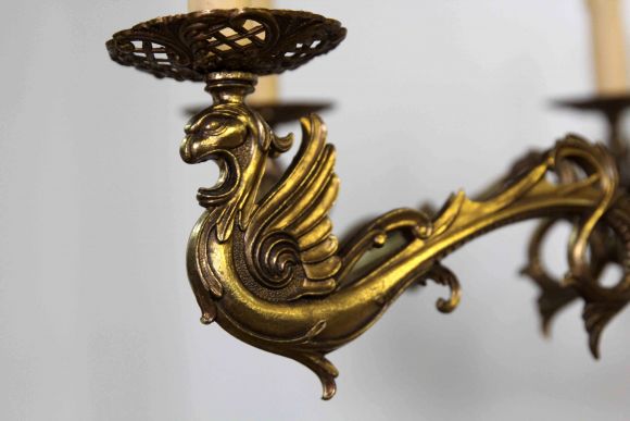 Бронзовая интересная люстра с Грифонами